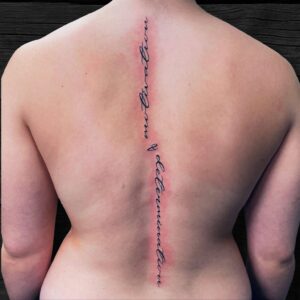 Perfect Script Lettering Tattoo Down The Spine